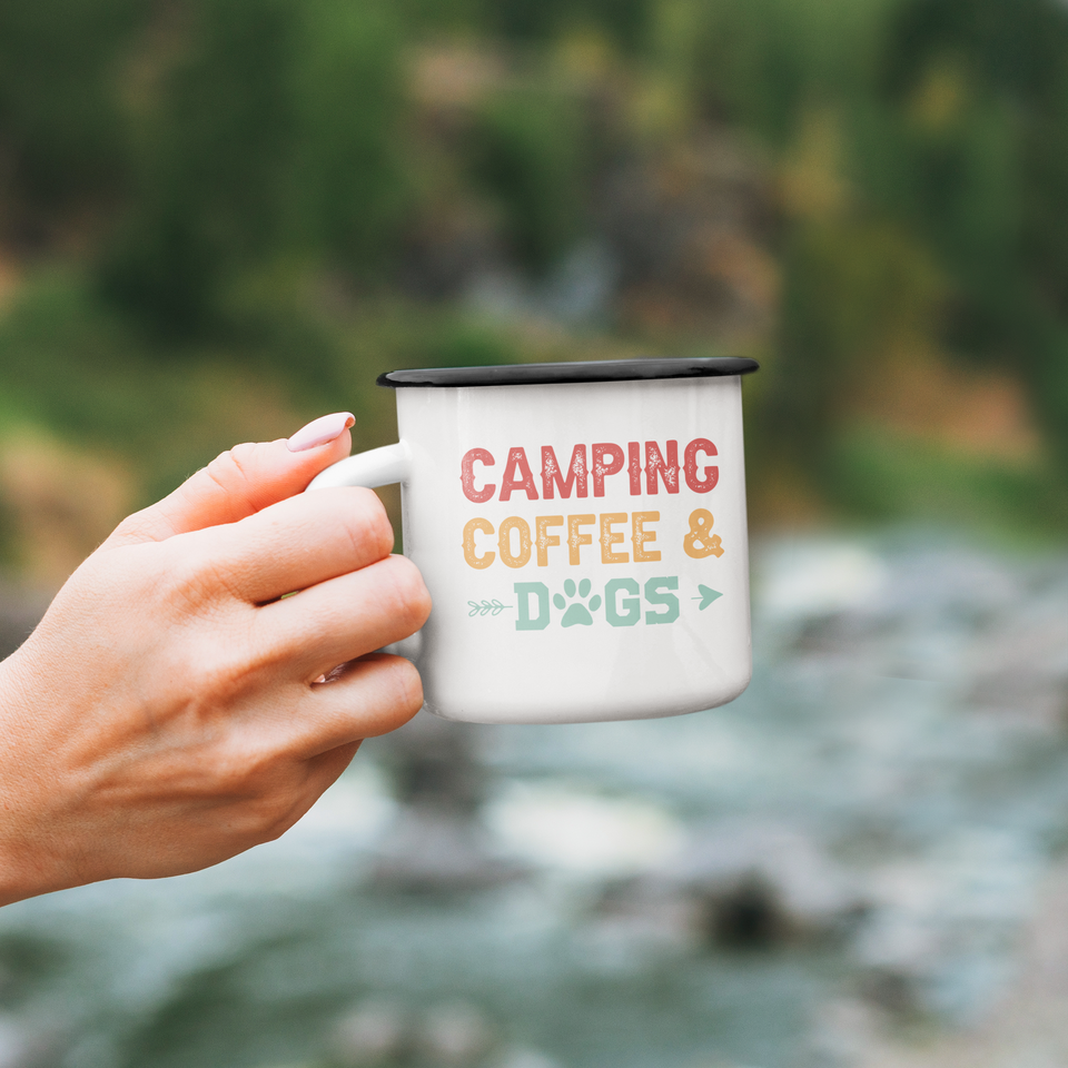 Hand holding Enamel mug camping, coffee & dogs