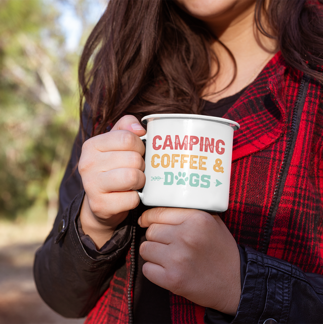 Woman holding Enamel mug camping, coffee & dogs