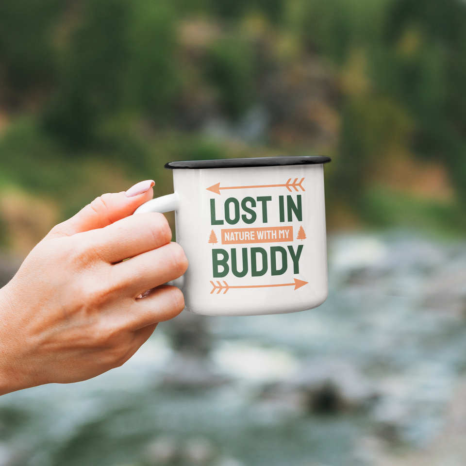 Hand holding enamel mug Lost in nature with my buddy