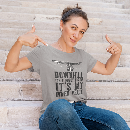 Confident woman pointing at her t-shirt that says Downhill Isn't Hobby For Me It's My Inner Peace