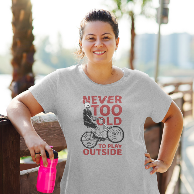 Smiling woman in Never too old to play outside tee