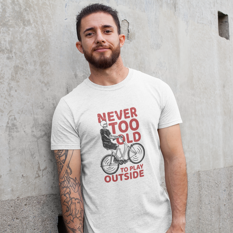 Smiling man in Never too old to play outside tee